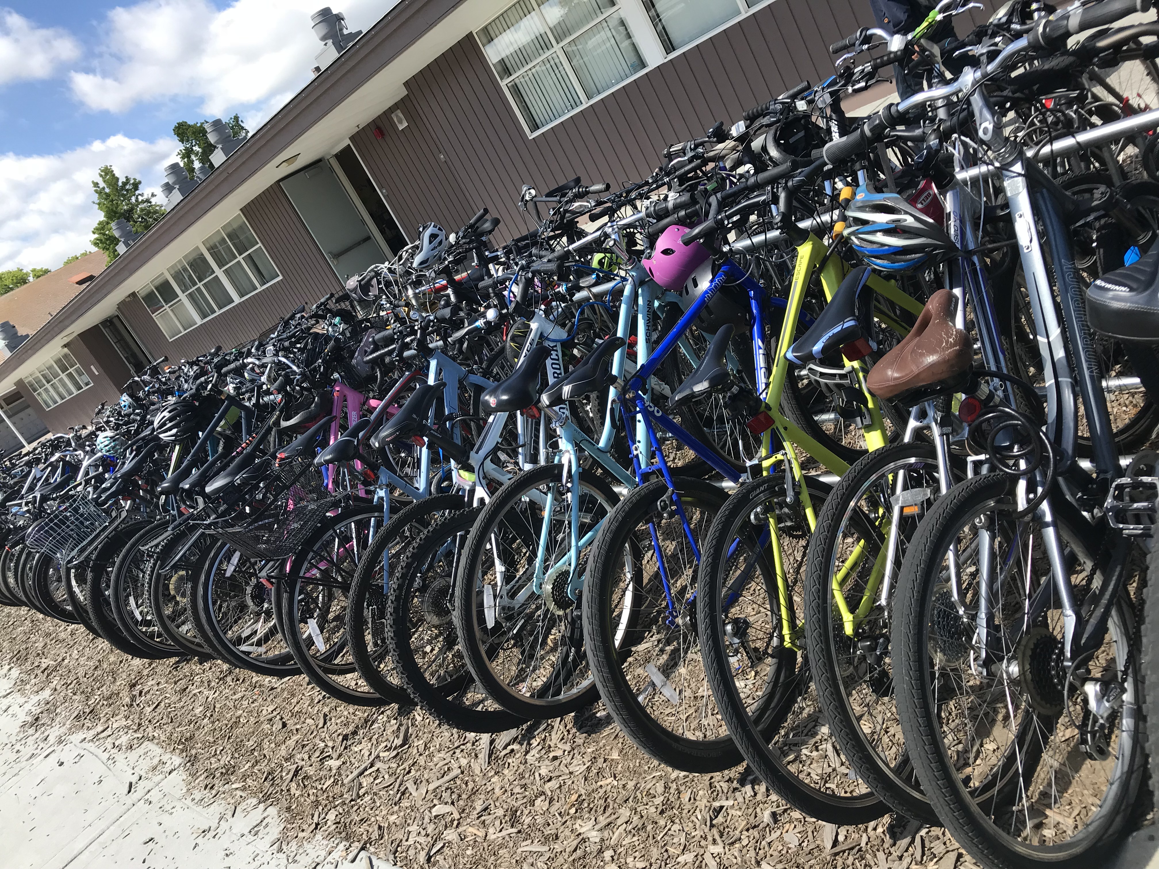 A row of bikes on a bike rack